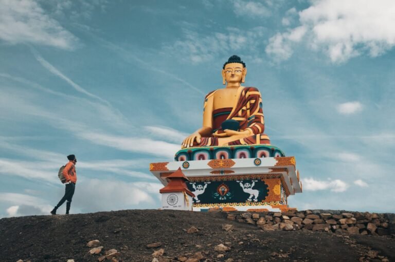 A person in front of Lorn Buddha